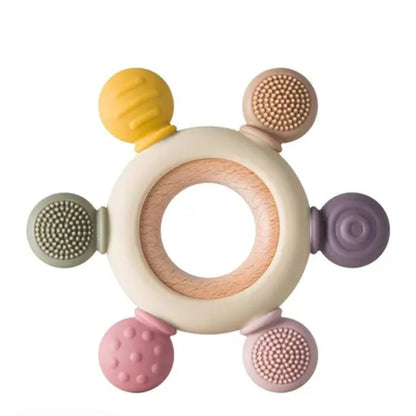 Colorful baby teething ring with various textured nodes on a white background